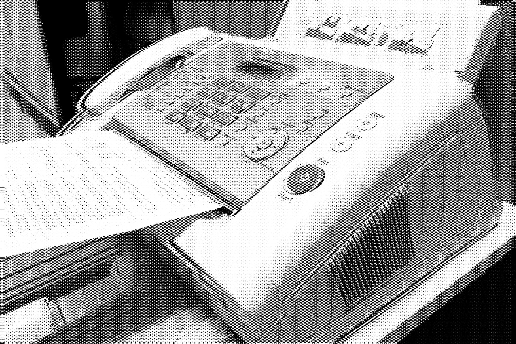 a glitchy edited photo of a fax machine